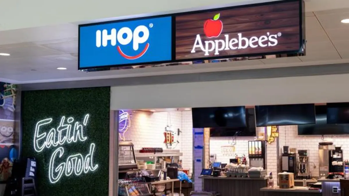 An image of a Applebee's and IHOP dual-branded restaurant inside an airport