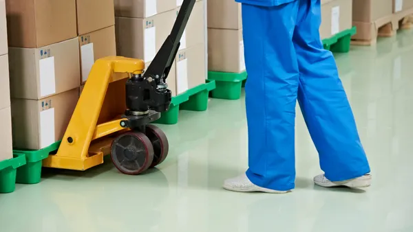 Person using manual hand pallet trucks