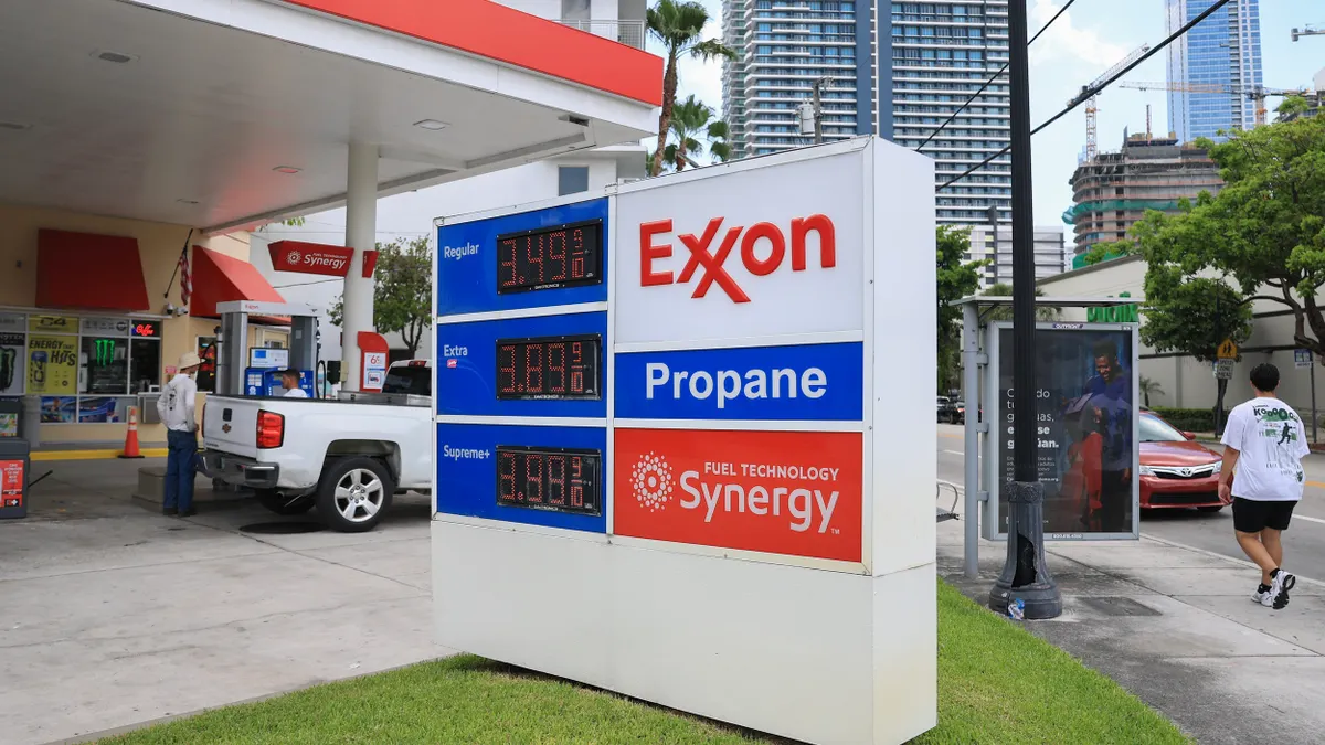 Customers at an Exxon gas station on May 22, 25 in Miami, Florida