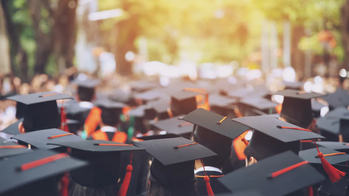 College students wearing caps and gowns for graduation