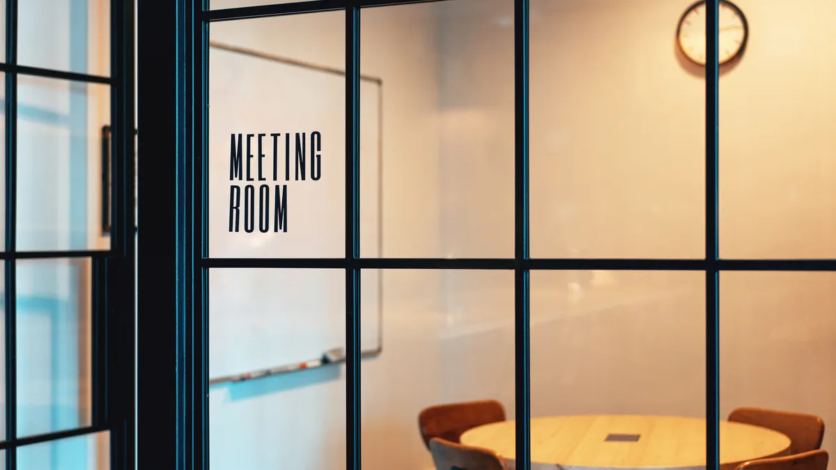 An empty meeting room with trendy black frames available for use