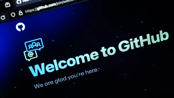 A dark screen shows light colored text reading "Welcome to GitHub" and "We are glad you're here."