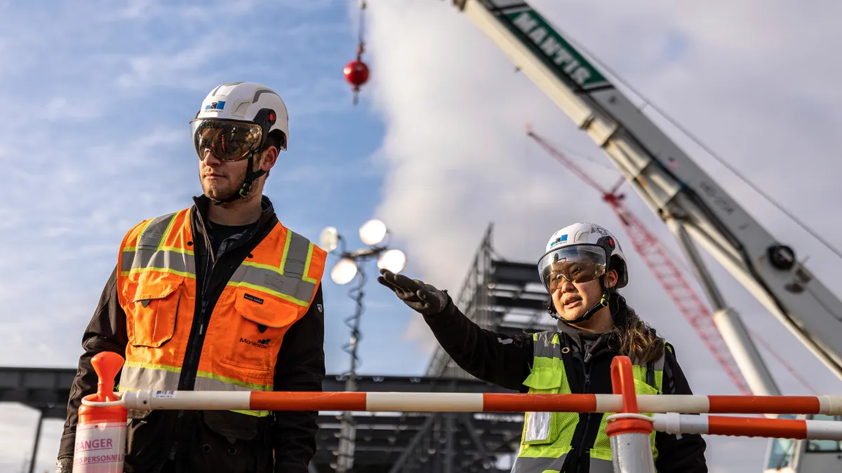 Construction personnel discussing plans