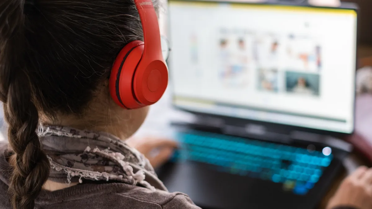 A woman browses an ecommerce site on her computer