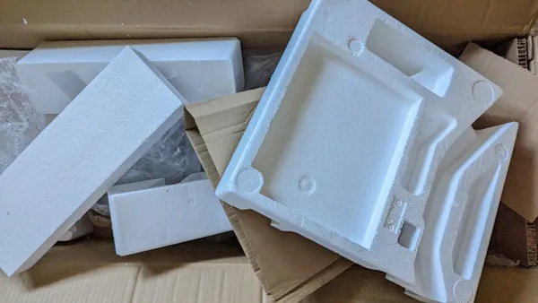 A variety of packaging, including expanded polystyrene foam next to cardboard boxes.