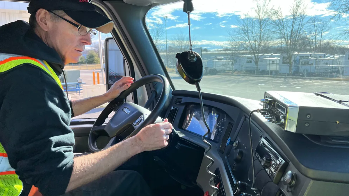 XPO driving instructor Don Giffin drives a truck at the company's Hagerstown terminal.