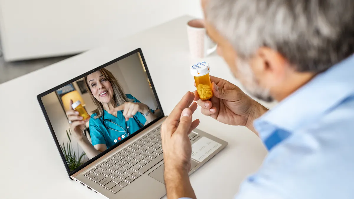 Man at home, getting advice from his doctor on a video call.