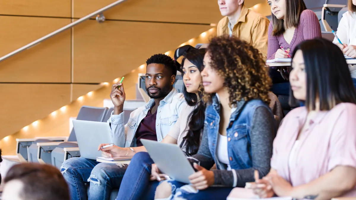 University students listen attentively to lecturer.