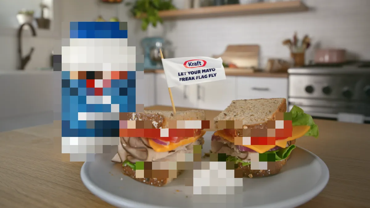 A sandwich and jar of Kraft Mayo have been pixelated to hide the condiment