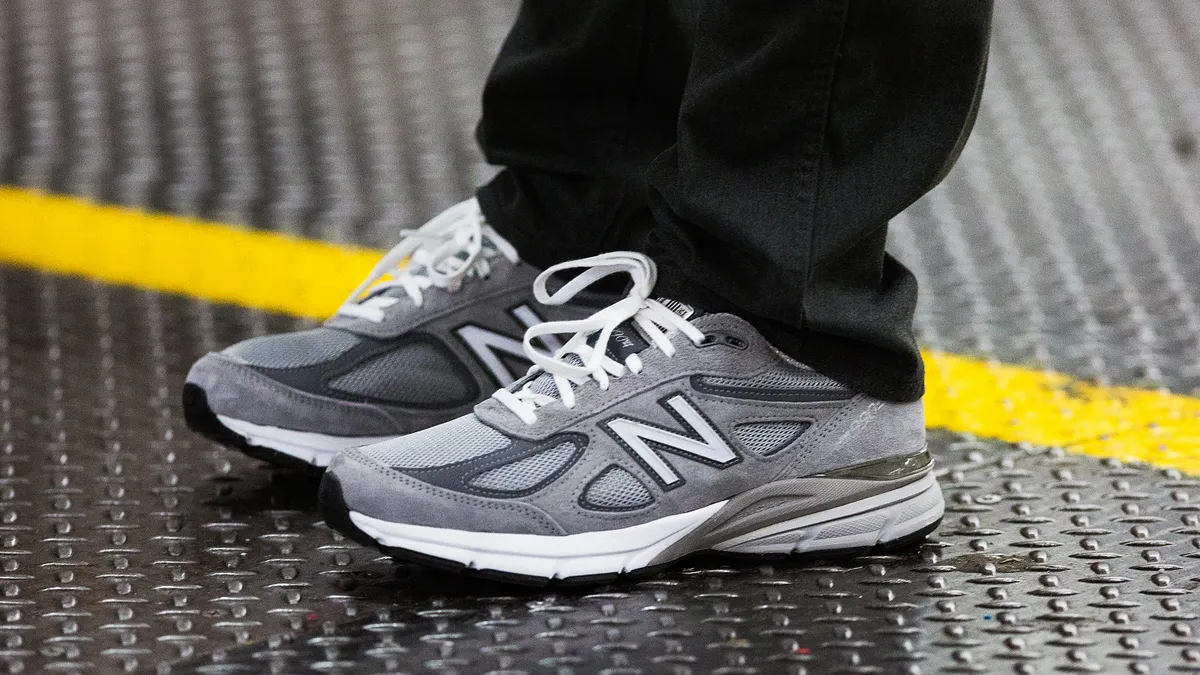 A closeup of New Balance CEO Robert DeMartini wearing New Balance 990 dad shoes.