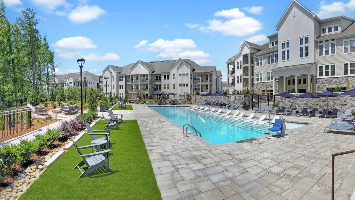 Garden-style apartment property surrounding a pool.