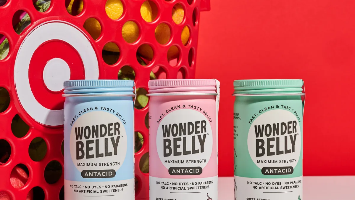 Wonderbelly products lined up in front of a Target shopping basket.