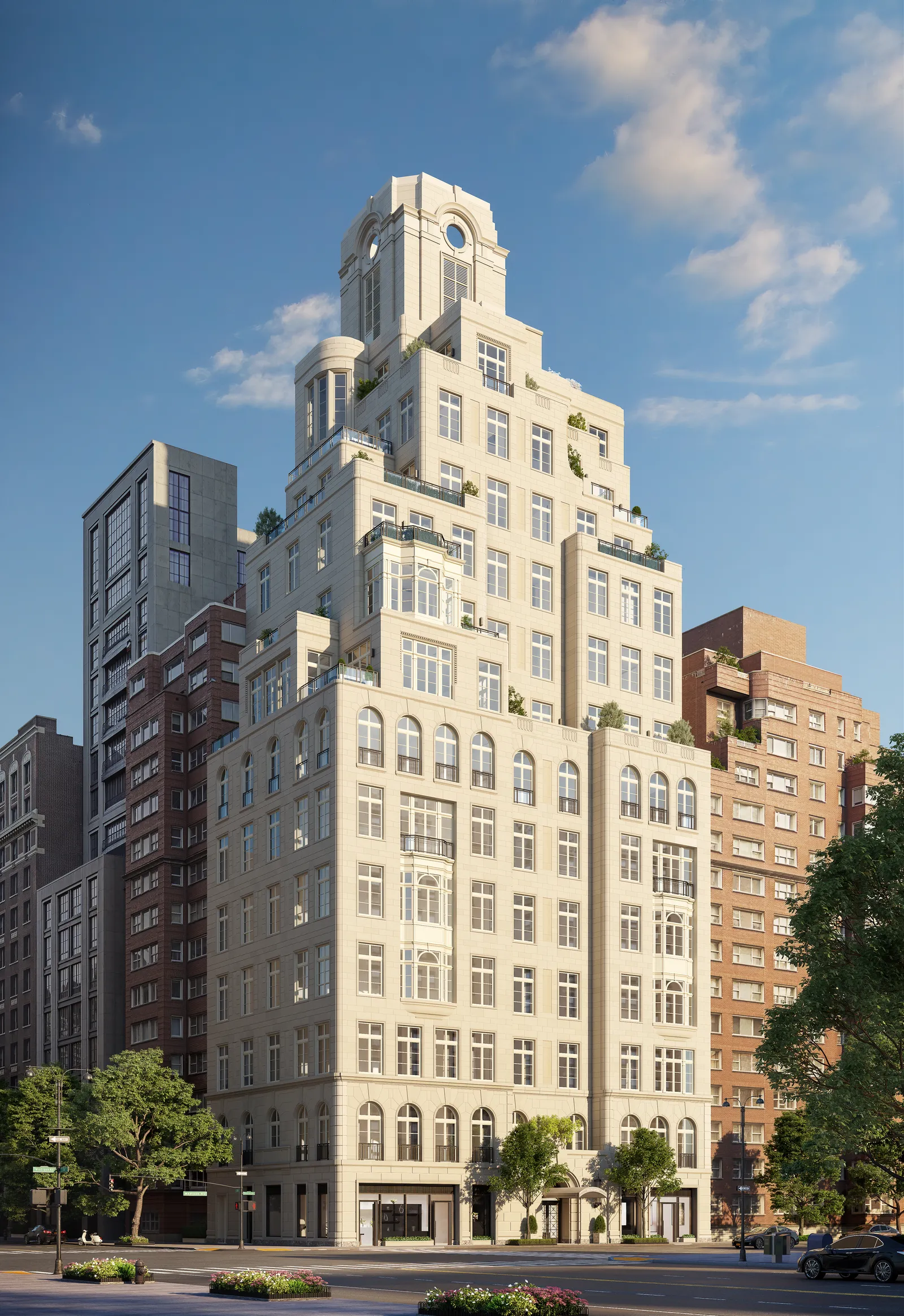 A white building on a city street lined with skyscrapers.