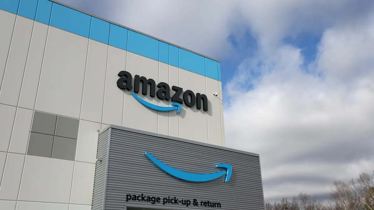 The Amazon logo is displayed on the exterior of an Amazon delivery station on November 28, 2022 in Alpharetta, Georgia.