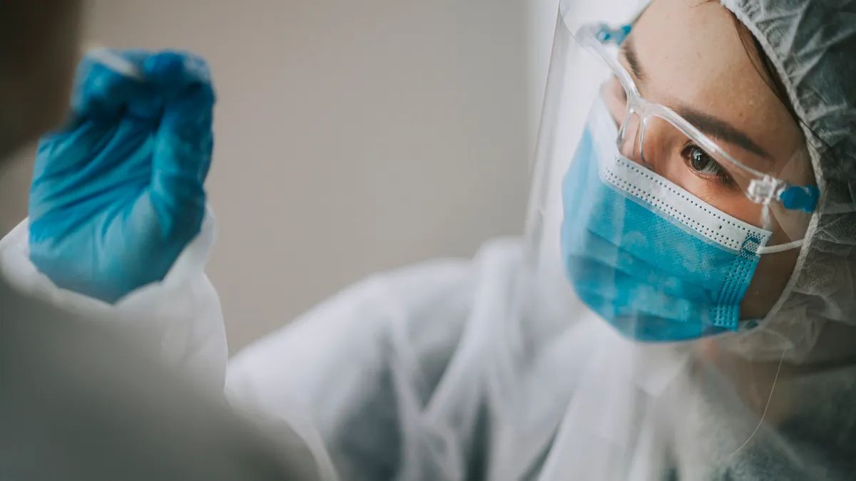 Shot of healthcare professional in PPE gear