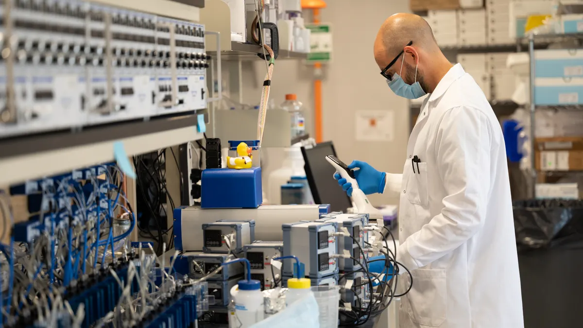 A person works in Sionna Therapeutics' lab.