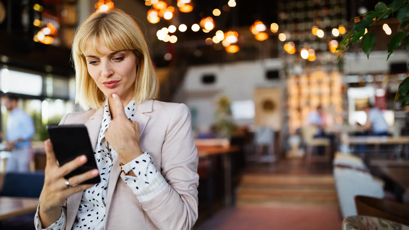 Beautiful brunette coworker businesswoman talking on mobile phone