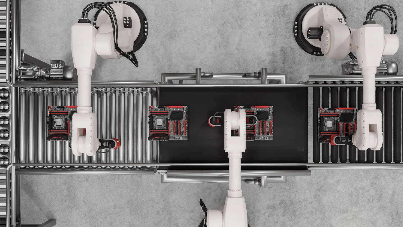 Overhead view of white robotic arms on an assembly line