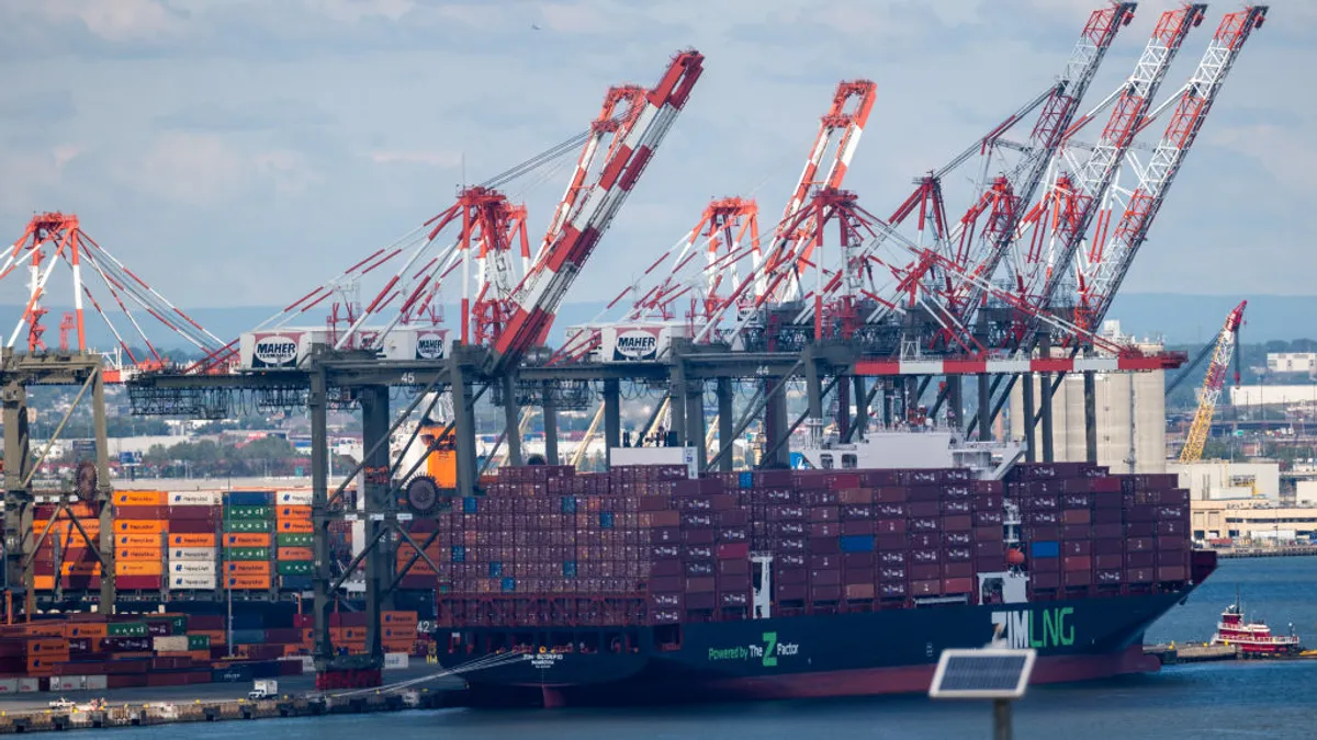 Shipping containers sit stacked in the Port of Newark.