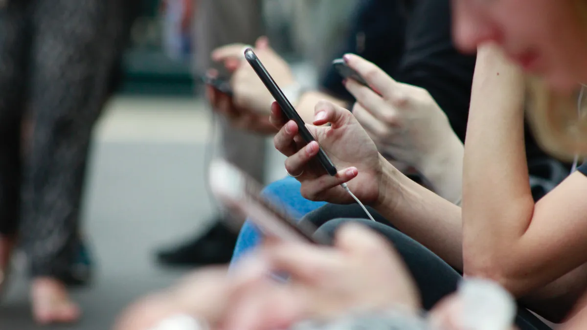 Person holding black phone