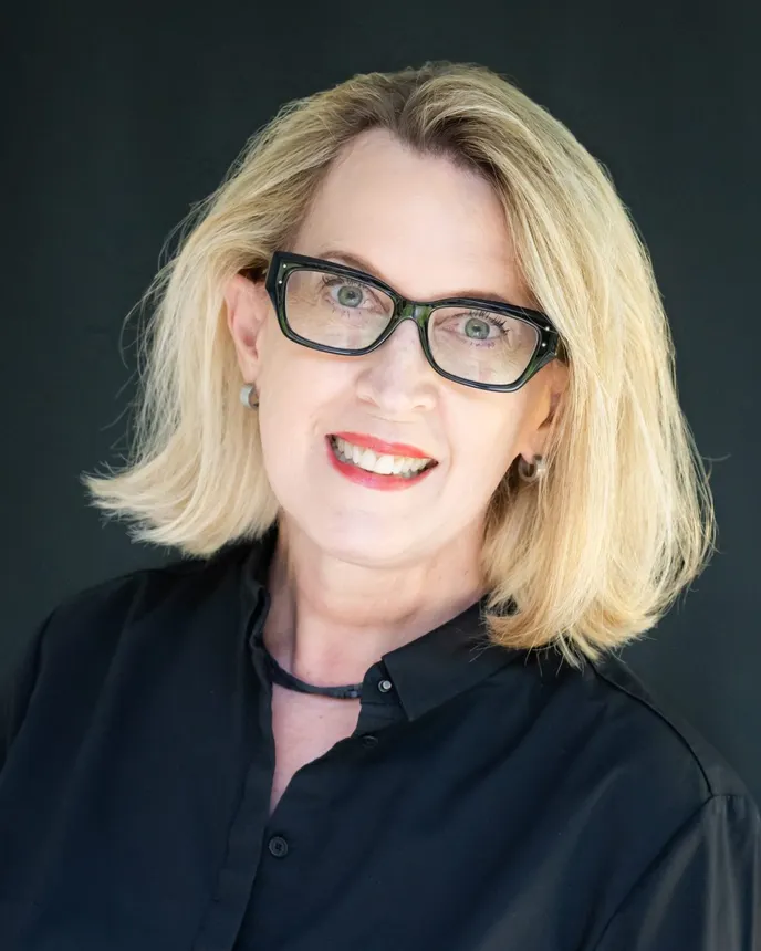 Headshot of a woman in professional attire.