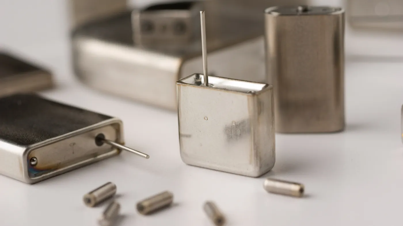 Metallic pacemakers and cylindrical electrodes displayed on a white surface