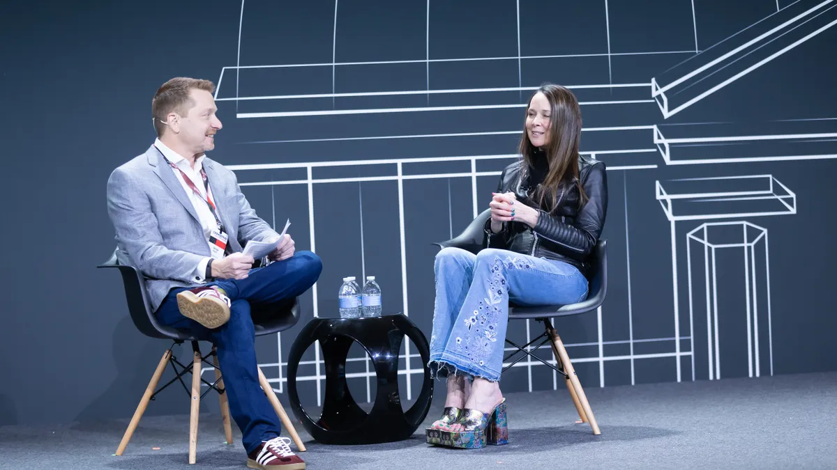 CISA Director Jen Easterly talks with CEO George Kurtz during the CrowdStrike Government Summit.