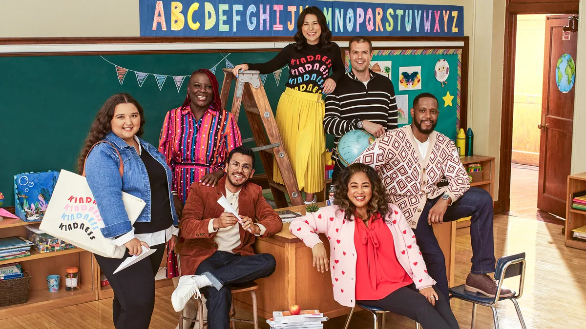 A group of people wearing J.C Penney's Abbott Elementary themed collection.