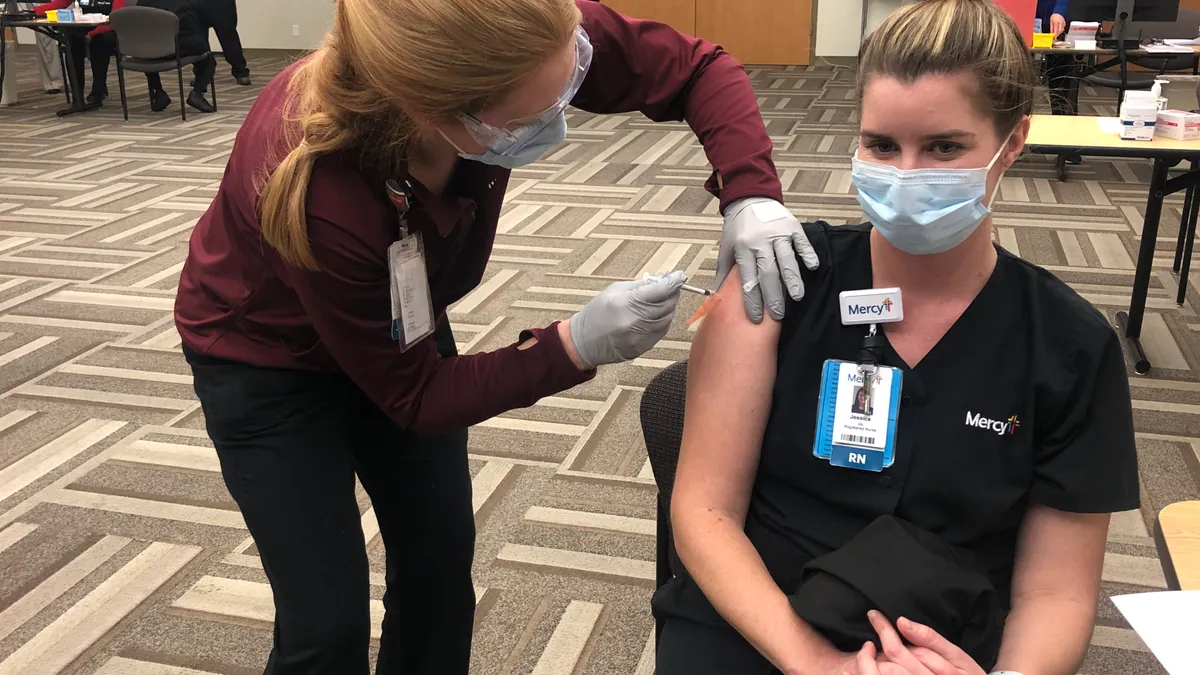 Jessica Bingley, an emergency room nurse in St. Louis, is among the first to receive a COVID-19 vaccine in the region on Monday, Dec. 14, 2020.