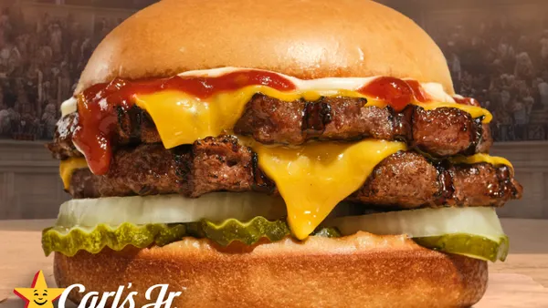 A close up shot of a burger with two patties.