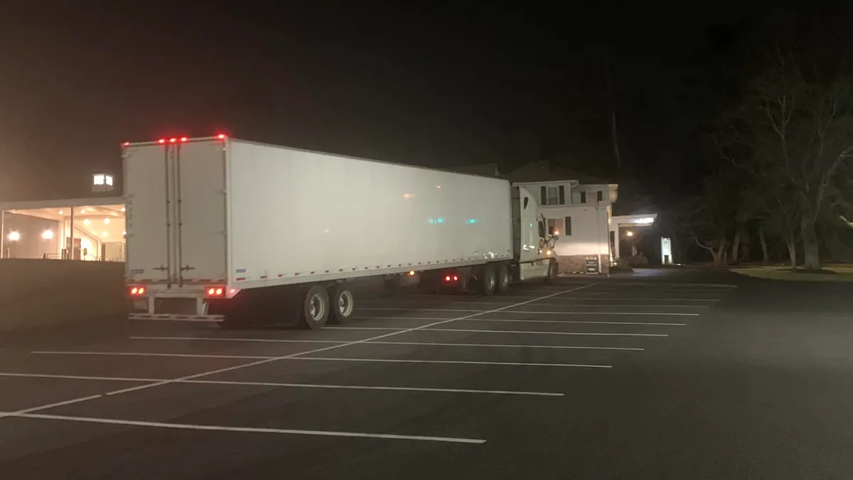 A tractor-trailer is parked in the lot of the Candle Light Funeral Home in Catonsville, Maryland.