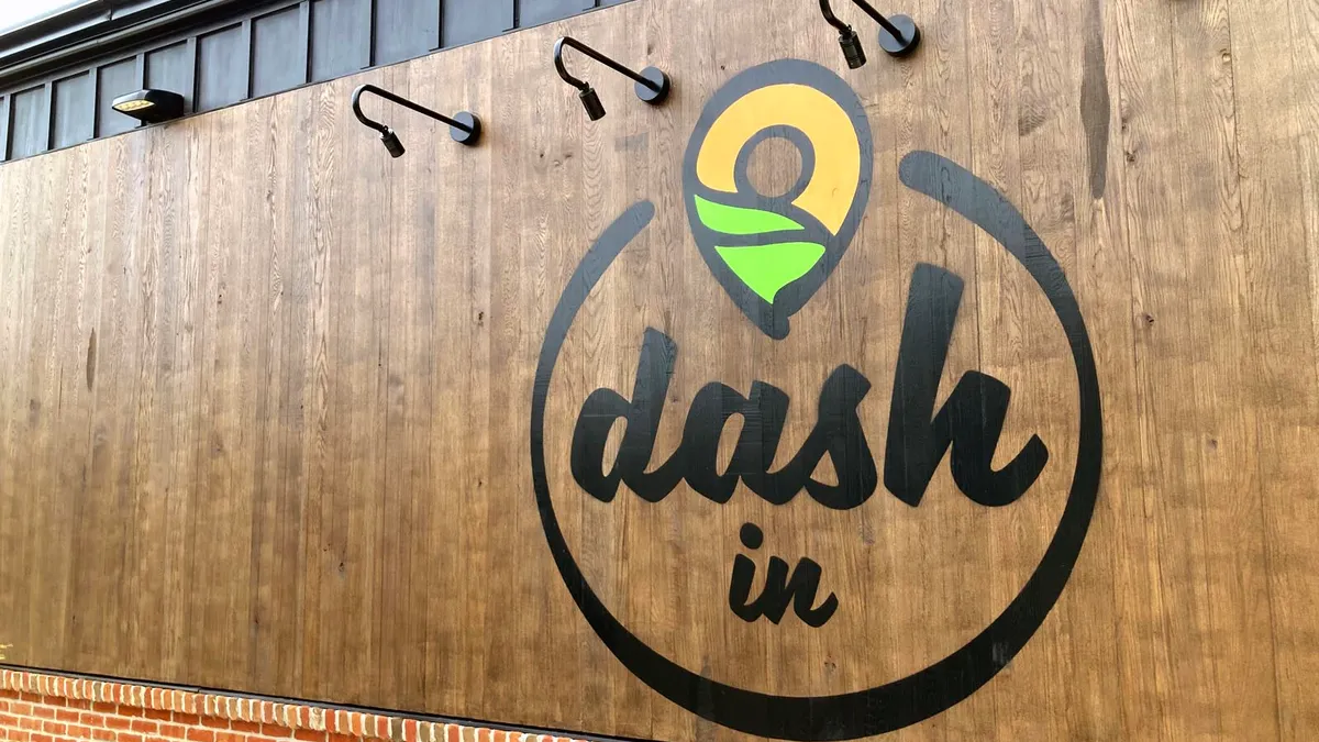 A photo of Dash In's new logo on the side of its new concept store.