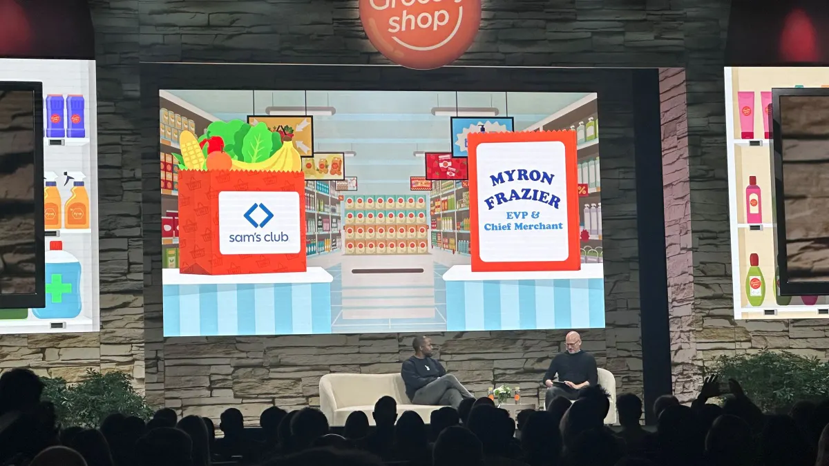 Keynote session at a conference, two men on stage