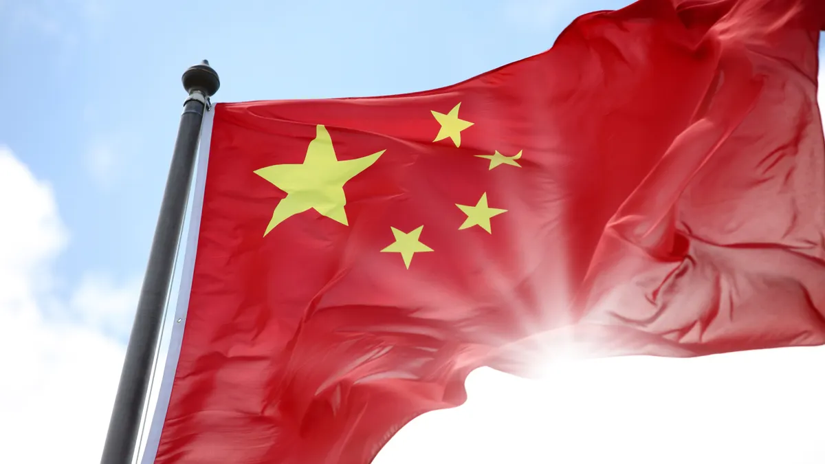 A chinese flag blowing in the wind