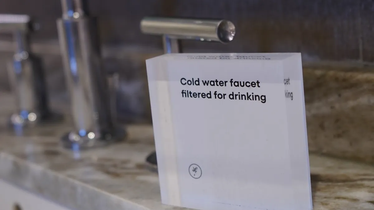 A sign at the L7 Chicago by Lotte hotel instructs guests that faucet water is filtered.