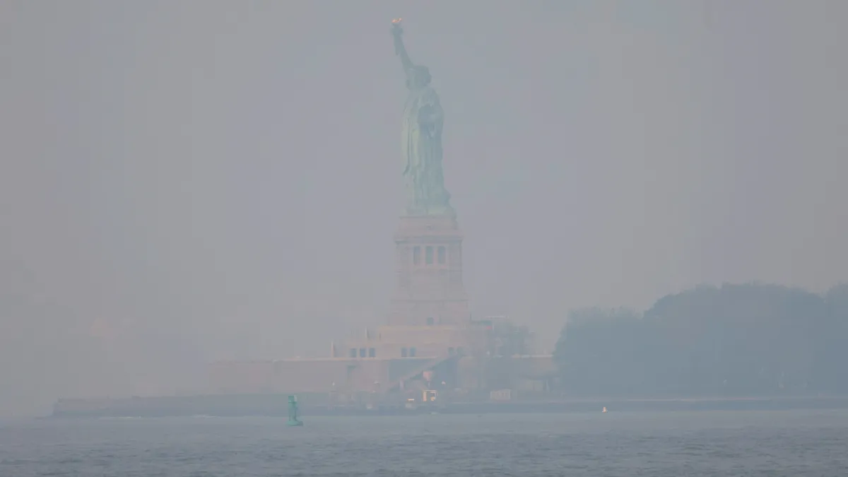 The Statue of Liberty is seen amid hazy conditions