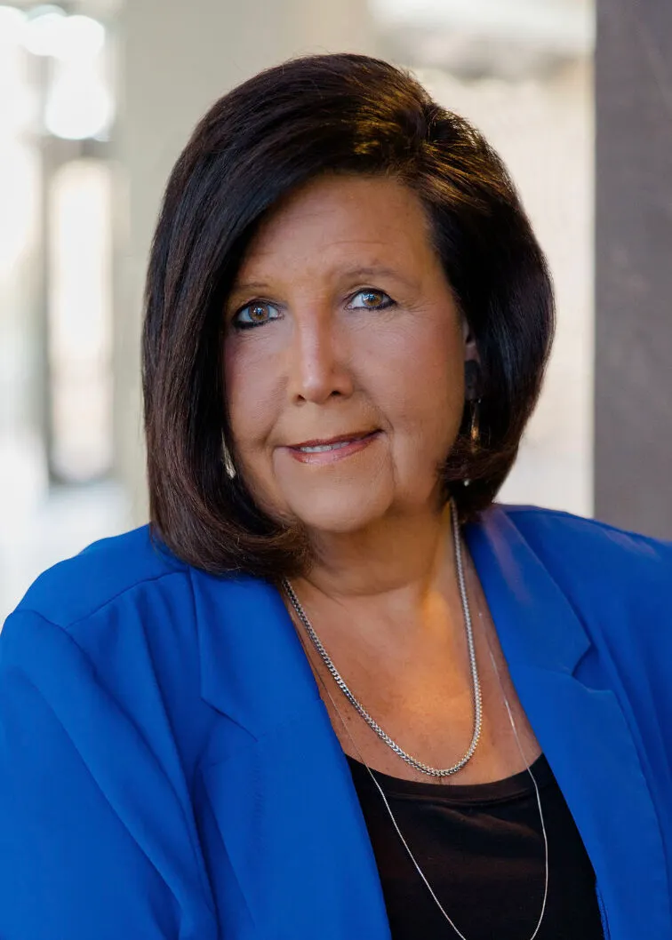 A professional headshot.