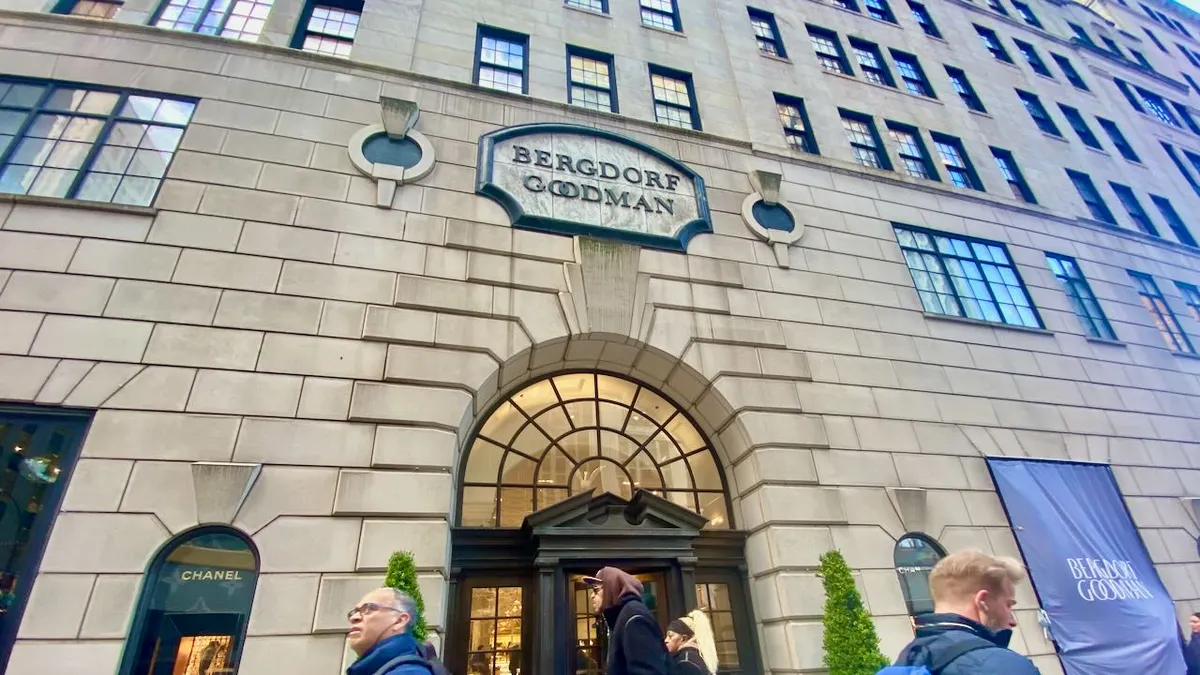 People walking past a huge department store.