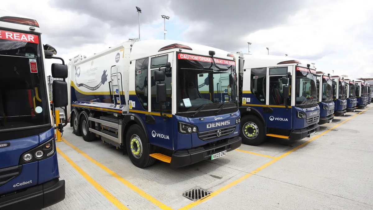 A row of Veolia electric refuse trucks in London