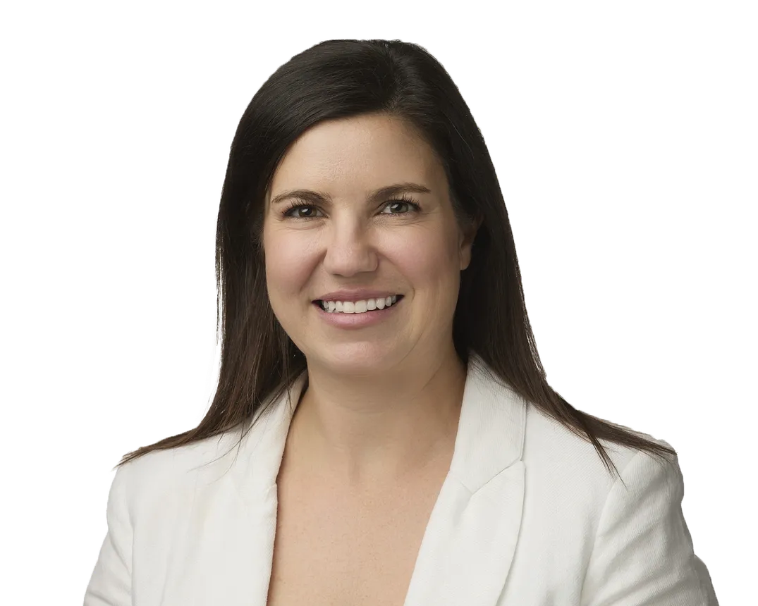 Woman with long straight dark hair in a cream blazer.