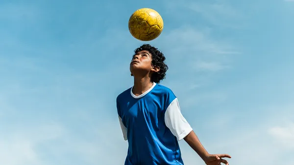 child with soccer ball