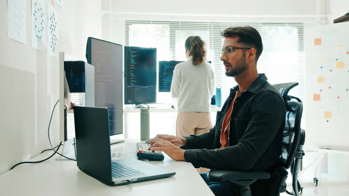 Two workers in an office.