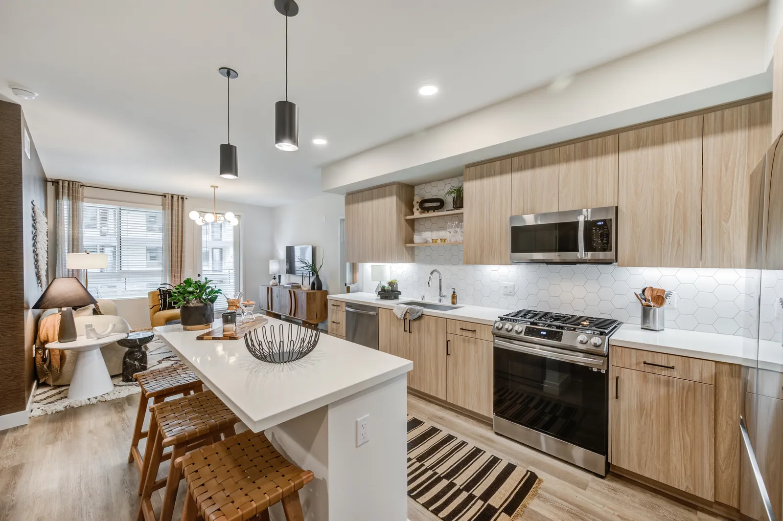 A kitchen and living room in an apartment.