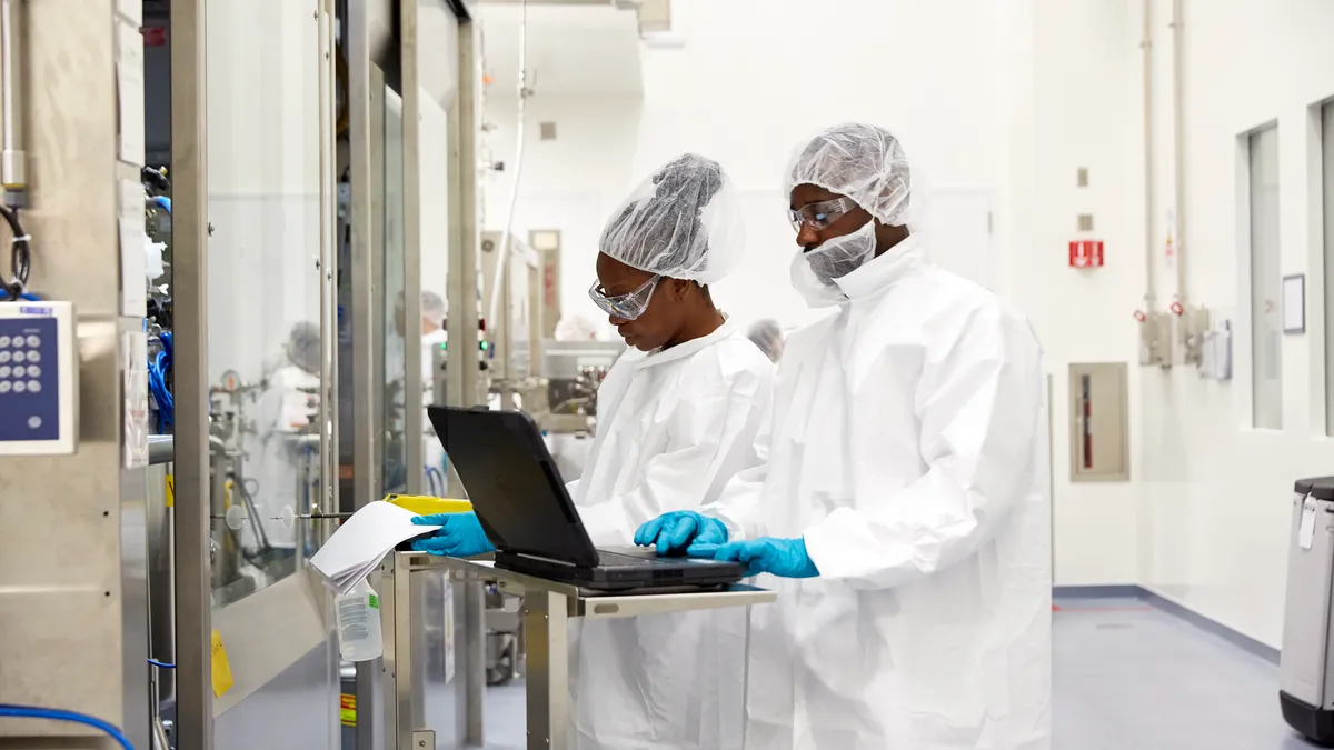 A photo of Biogen employees working in process engineering of antisense oligonucleotides