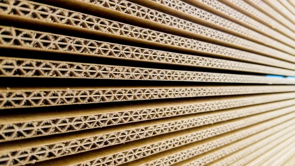 Close up view of stacked corrugated cardboard.