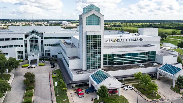 A sprawling hospital with "Memorial Hermann" on its facade.