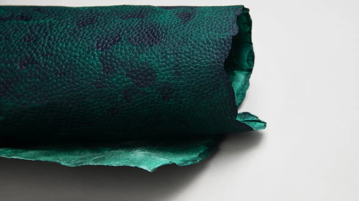 Rendition of a blue and green leather looking material.