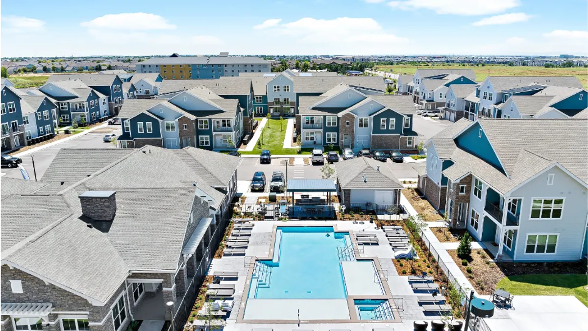 Overhead picture of apartment communities and a pool.