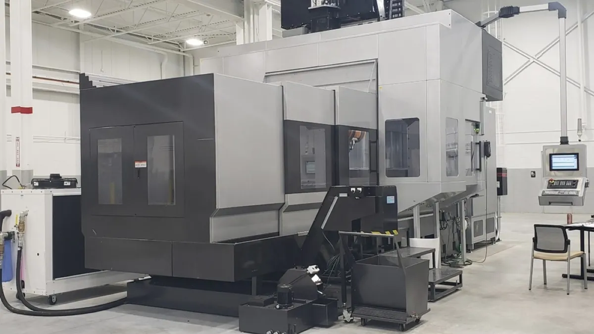 A large jointless hull subsection tool in a white open-spaced room.