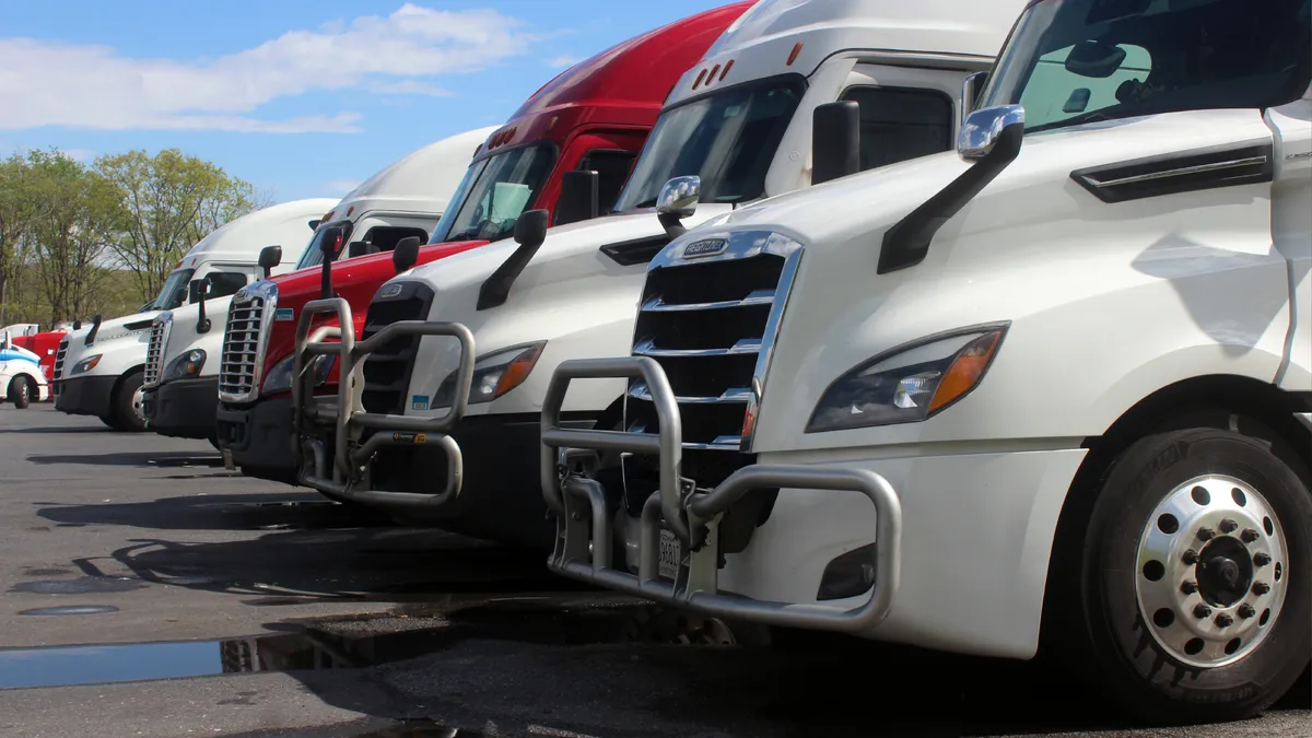 White and red tractors in a truck parking lot in western Maryland in May 2024.